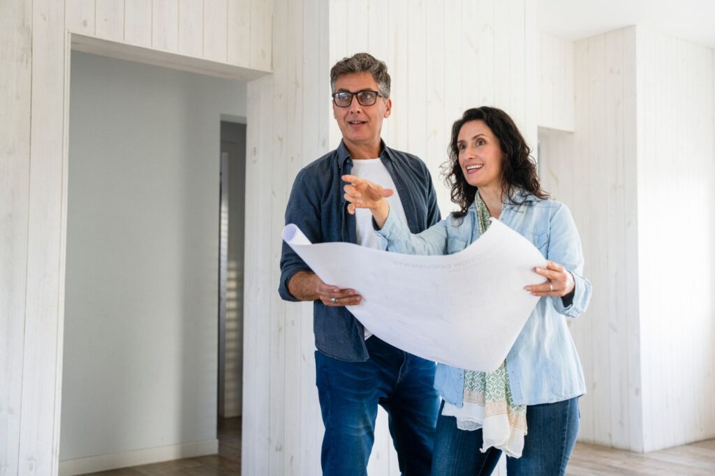 Homeowners reviewing remodel plans they could fund with a HELOC