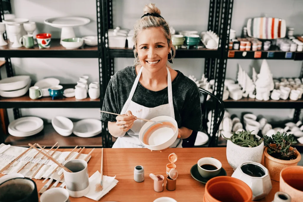 Small business owner in her ceramics studio, a typical self employed mortgage borrower in California